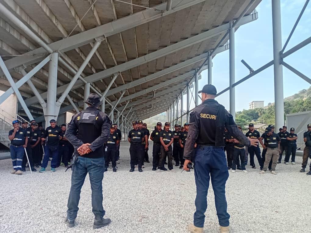 POM CITY WATCH personnel in formation at a Port Moresby market