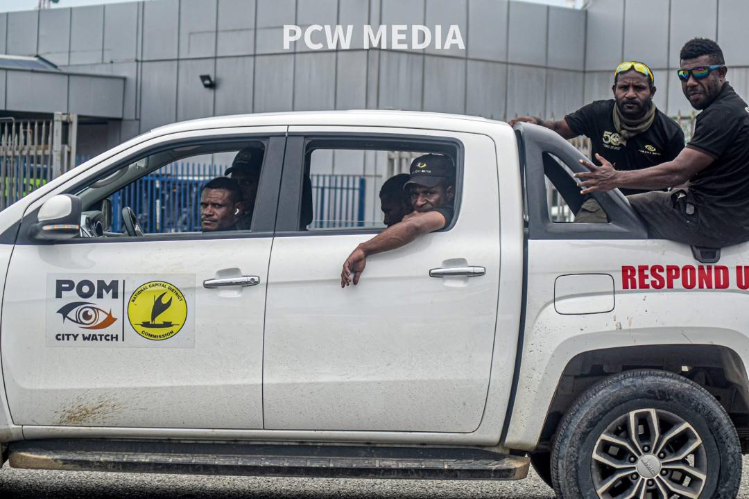 POM CITY WATCH personnel in a marked response vehicle